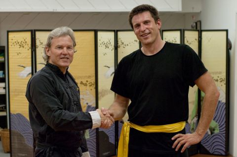 Michael Congratulates Baptiste on His Gold Belt